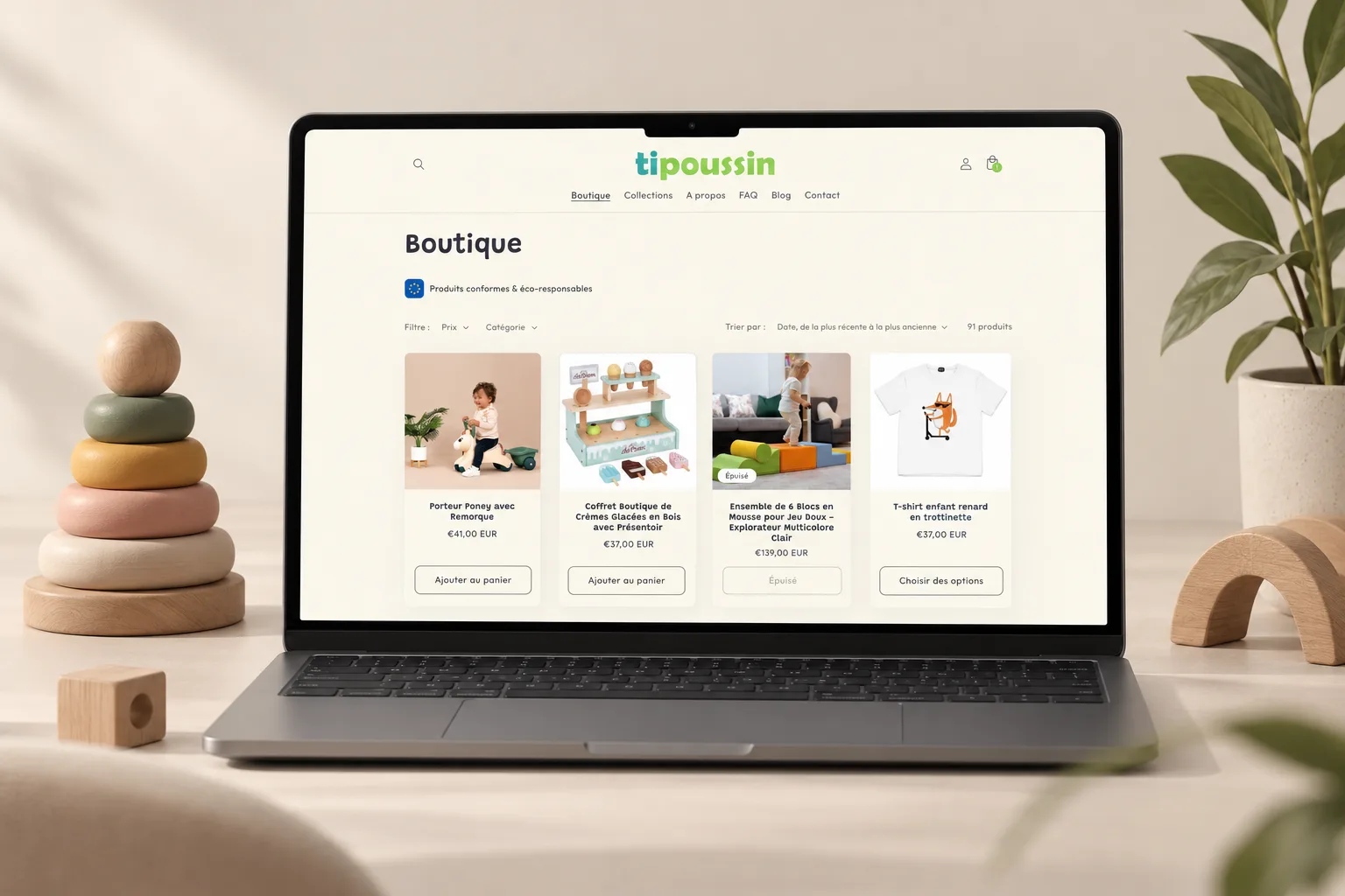 Boutique TiPoussin sur ordinateur avec une grille de produits pour bébé